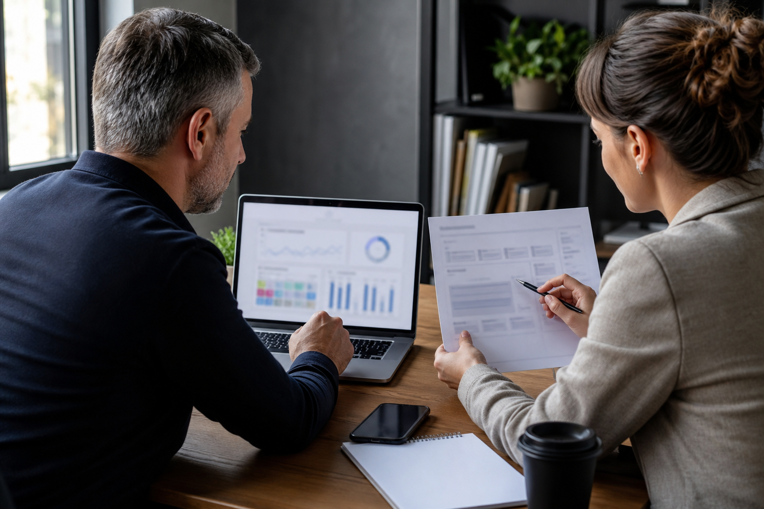SMB owner and consultant reviewing blurred AI search visibility evidence