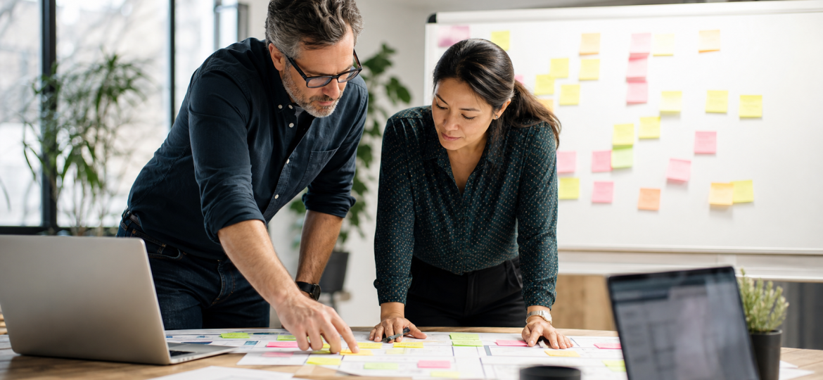 Small business owner and operations lead building an AI workflow map before buying automation tools