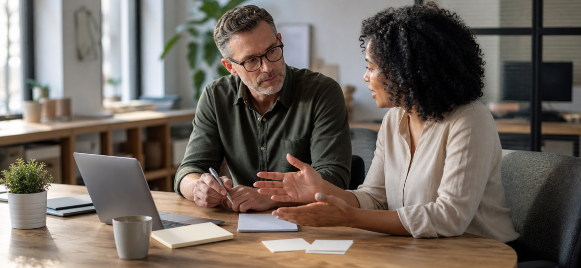 Small business owner and AI advisor reviewing a ChatGPT Search visibility plan