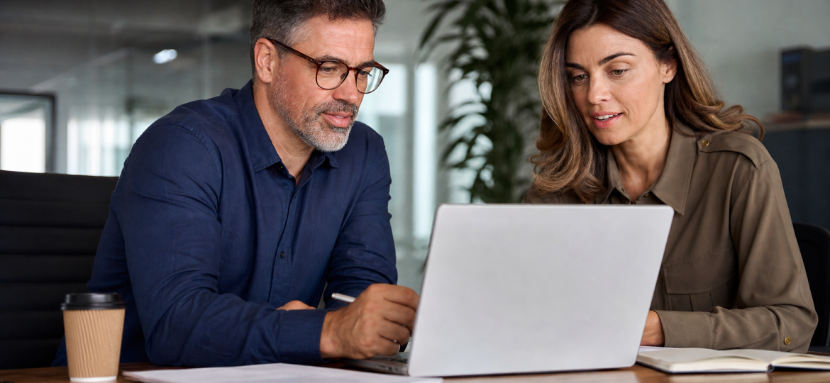 Small business owner and consultant reviewing Google AI Overviews visibility planning