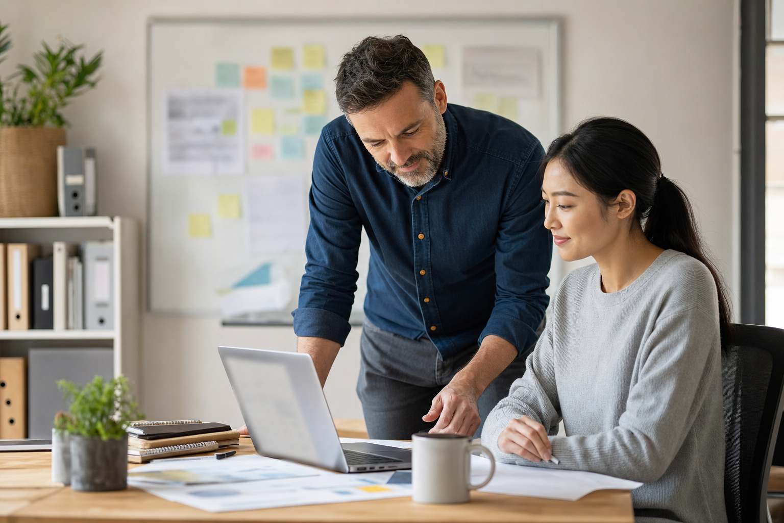 Small business owner reviewing an AI-assisted operations plan with a team member