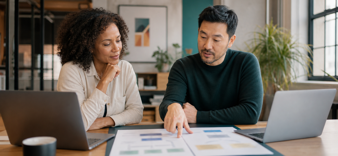 Small business owner and operations lead comparing two AI assistant options for business automation workflows