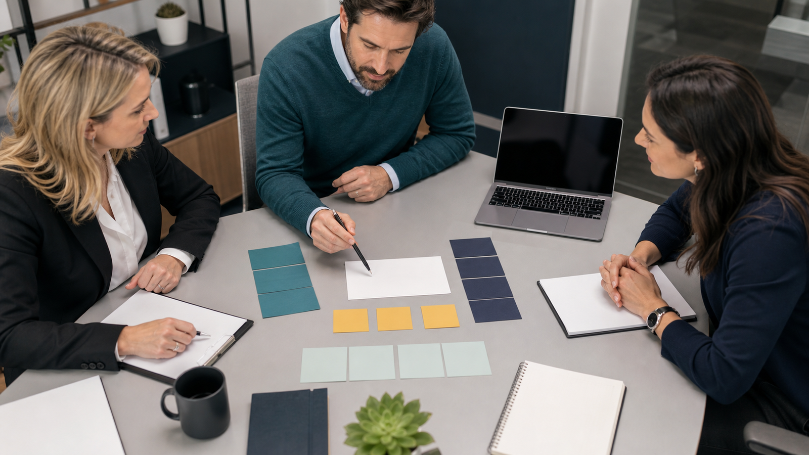 Small professional services team using blank cards to plan a query fan-out content brief