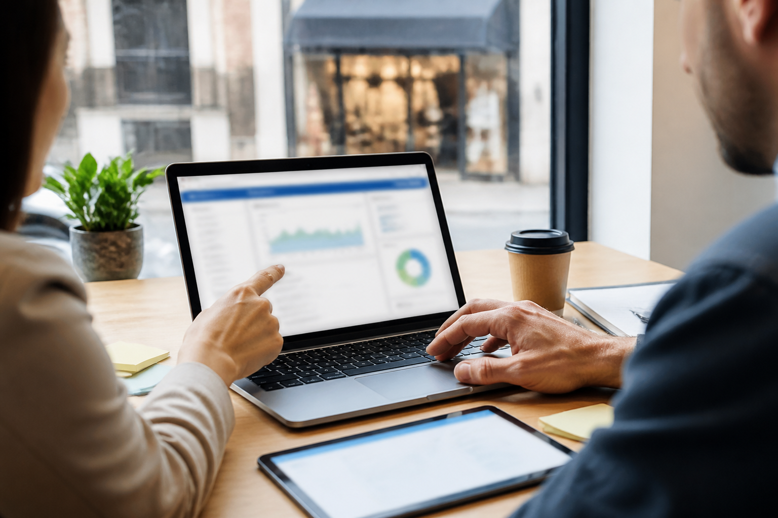 Small business owner and marketer reviewing crawl access and index signals on a blurred laptop screen