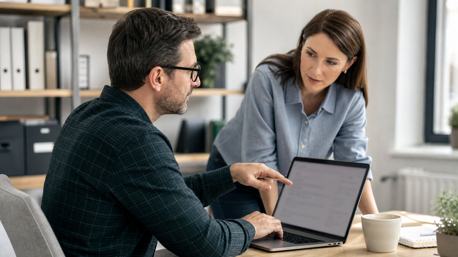 Small business manager reviewing an AI-assisted output before approval