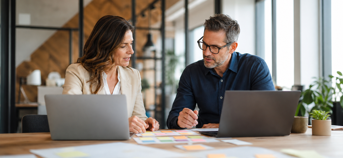 Business owner and advisor reviewing real customer workflow examples for AI search content