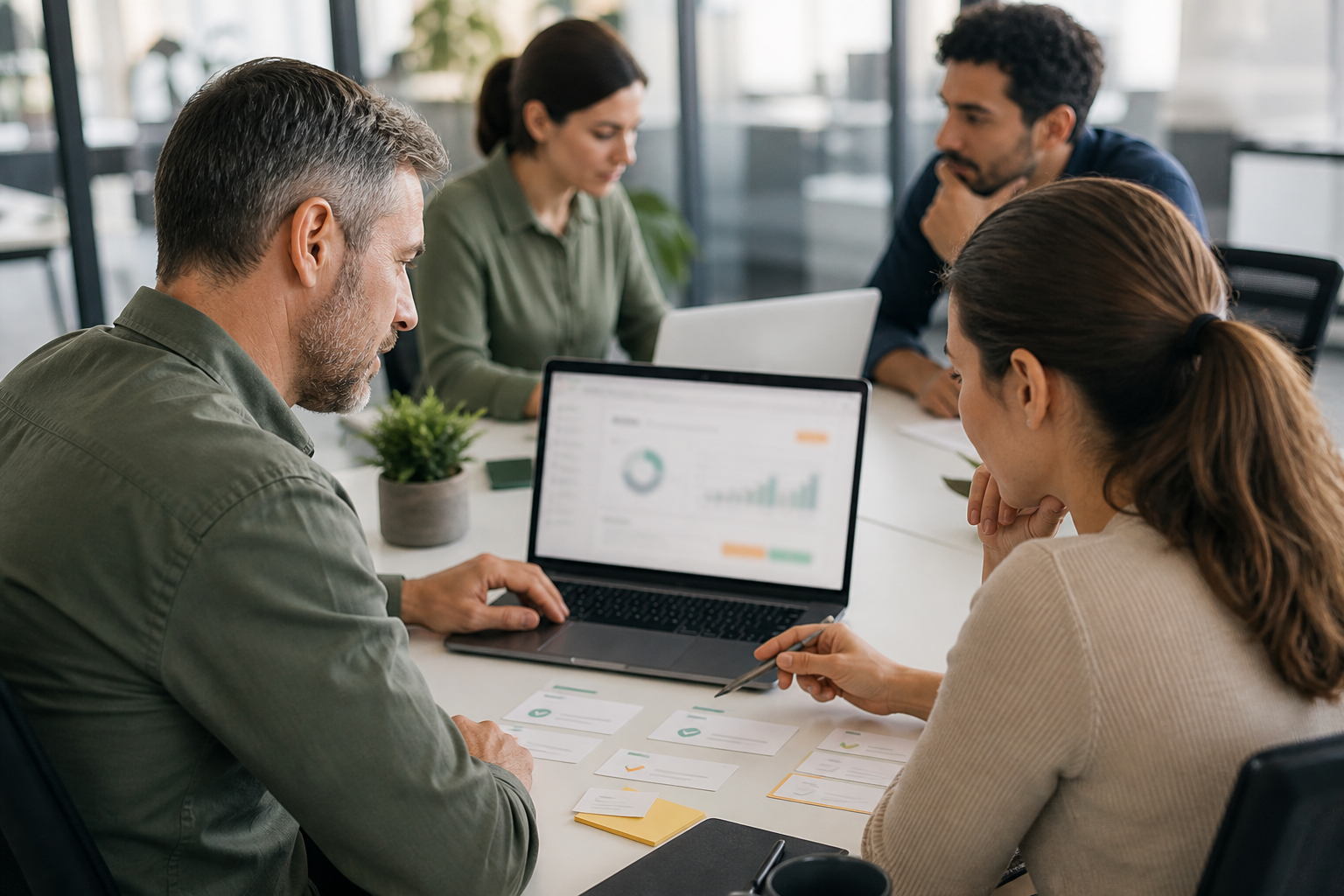 Small business team testing a controlled AI automation pilot with blurred dashboard and human review steps