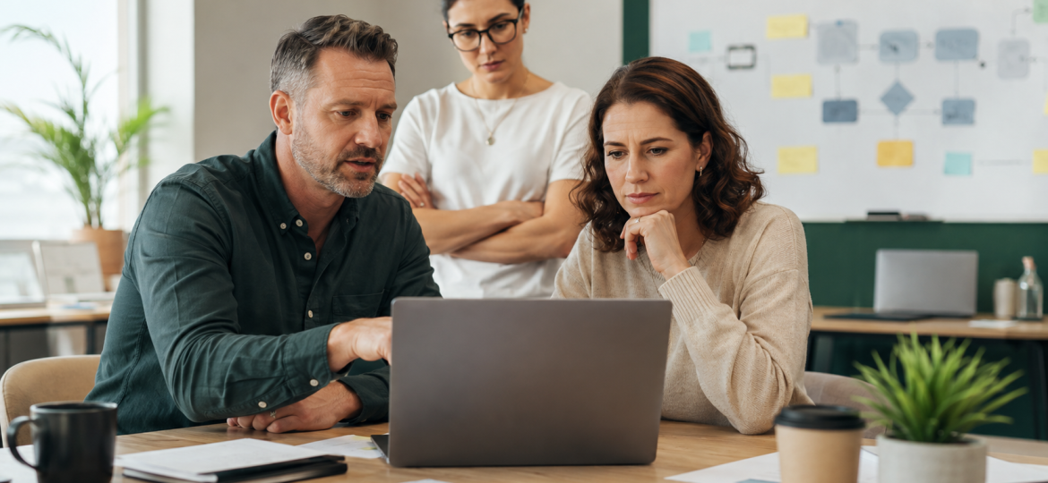 Small business team testing one AI automation pilot before scaling
